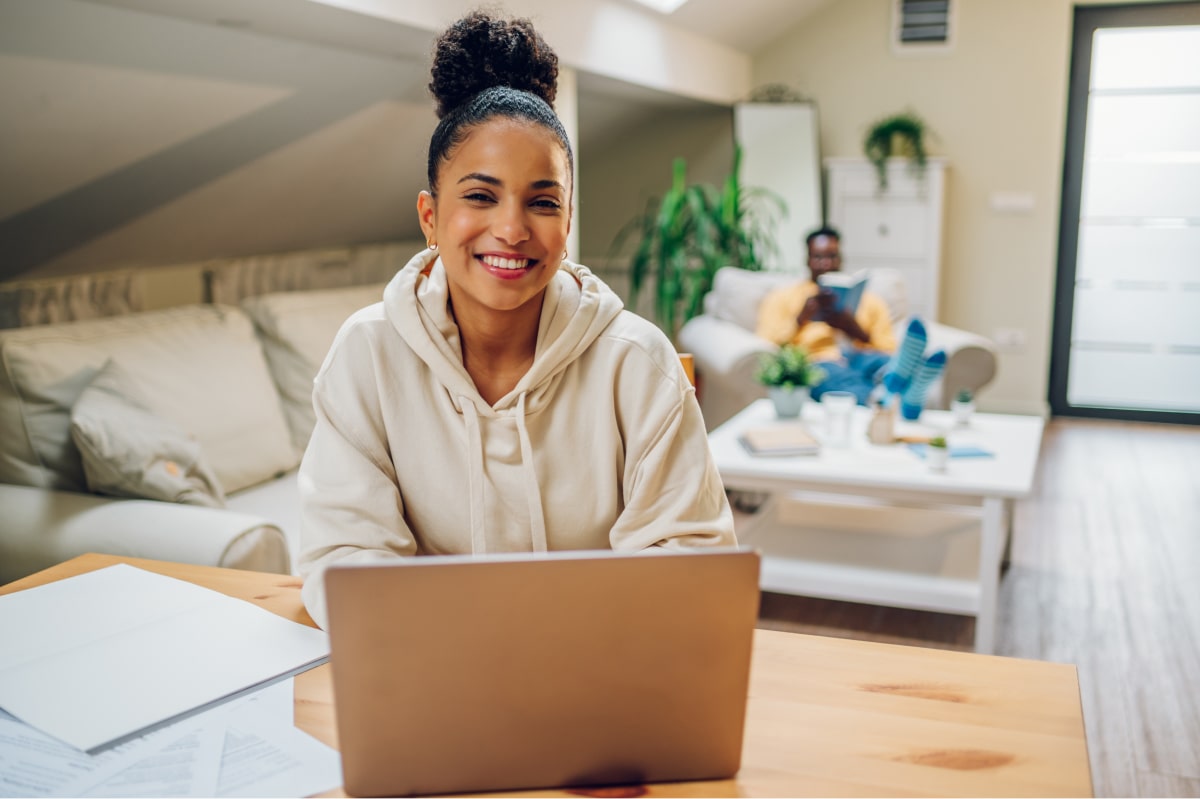 a high paid remote worker on her laptop